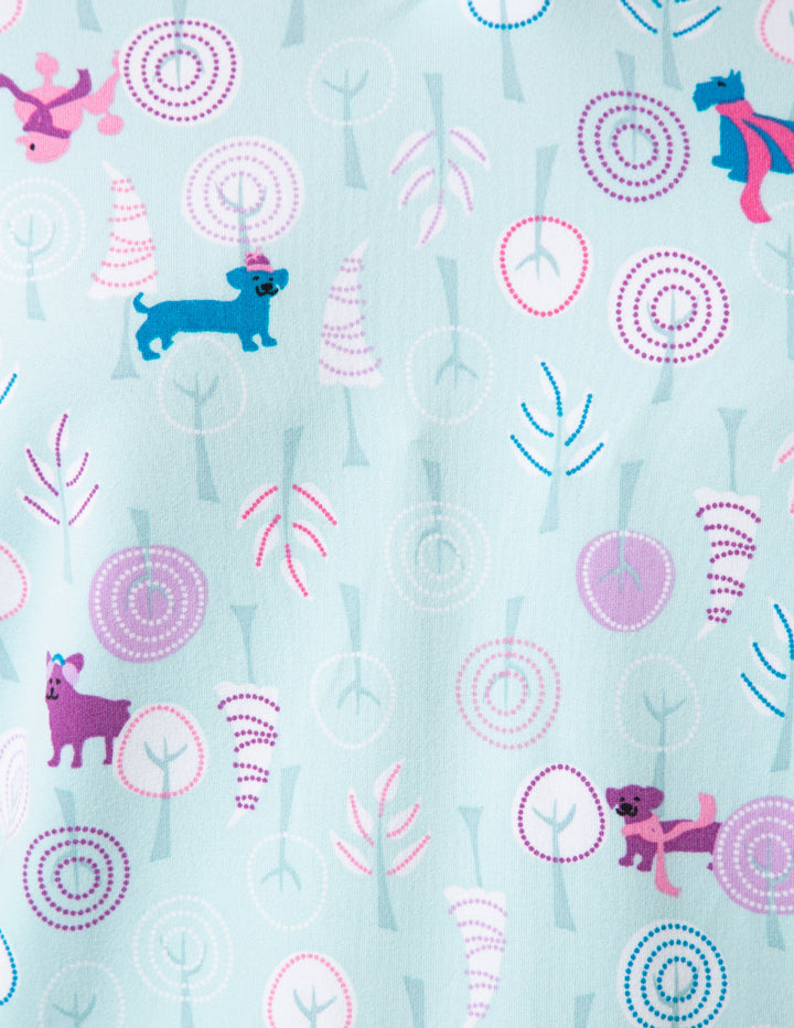 Patterned fabric with cartoon animals and abstract shapes on a light blue background