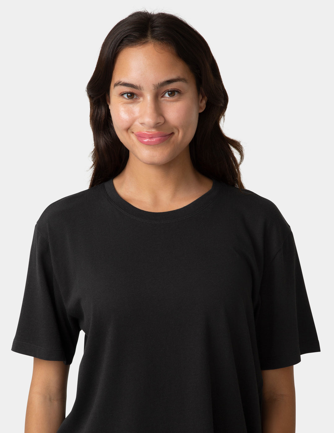 Person wearing a black t-shirt against a white background