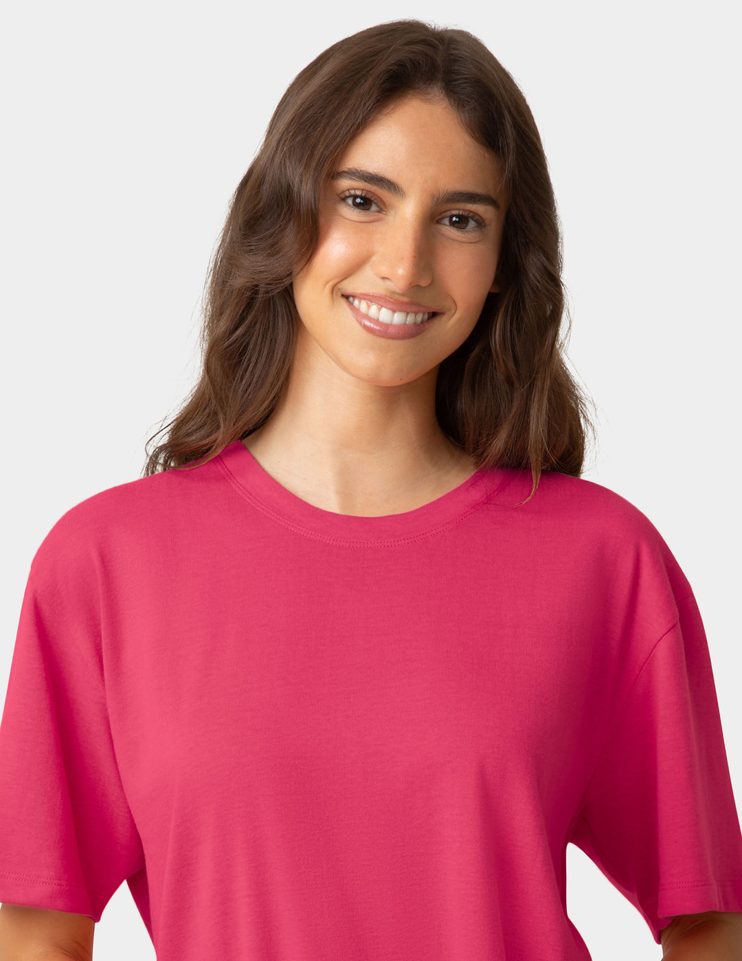Woman wearing a dark pink pajama t-shirt against a plain background