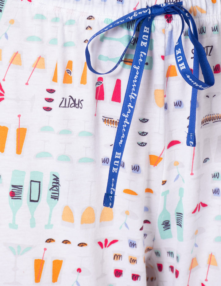 Patterned fabric with colorful designs and a blue ribbon
