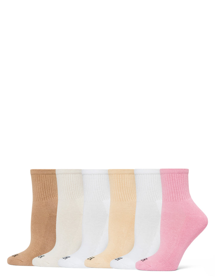 Set of six pairs of socks in beige, white, pink, and other colors on a white background