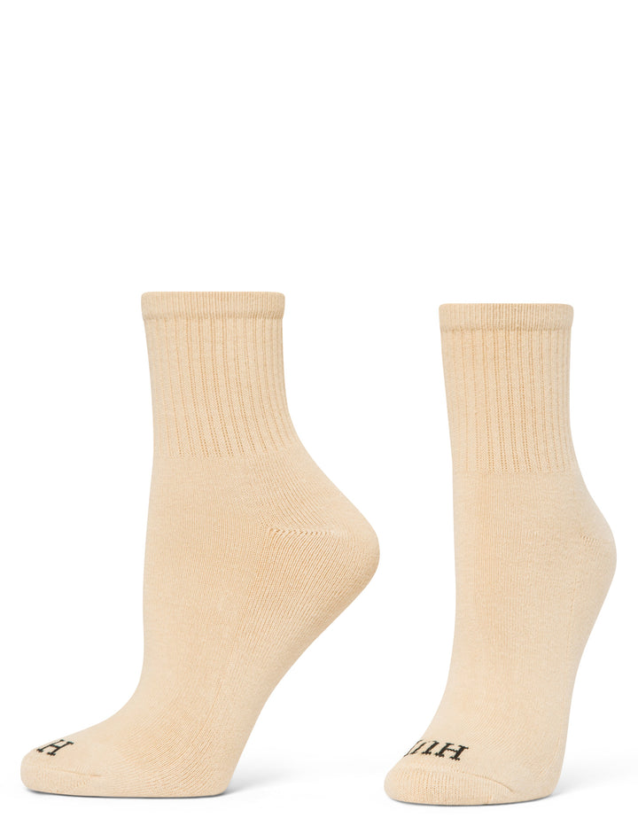 Pair of beige socks on a white background