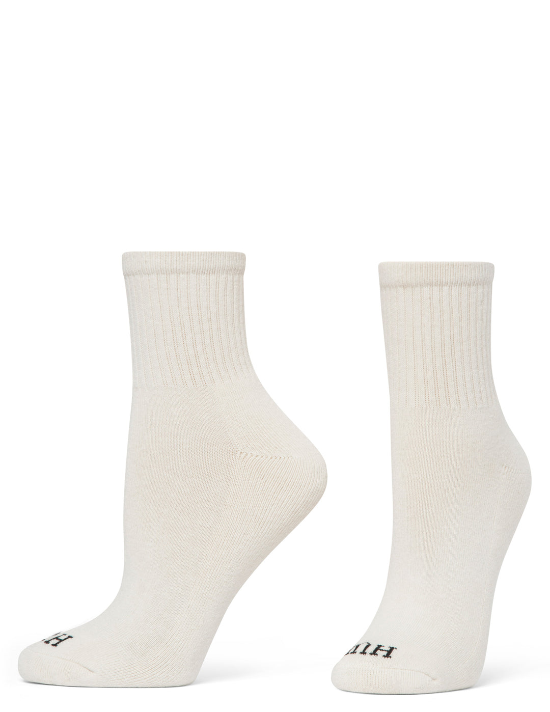 Two white socks with black branding on a white background