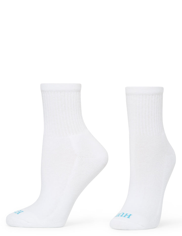 Two white socks with blue labels on a white background