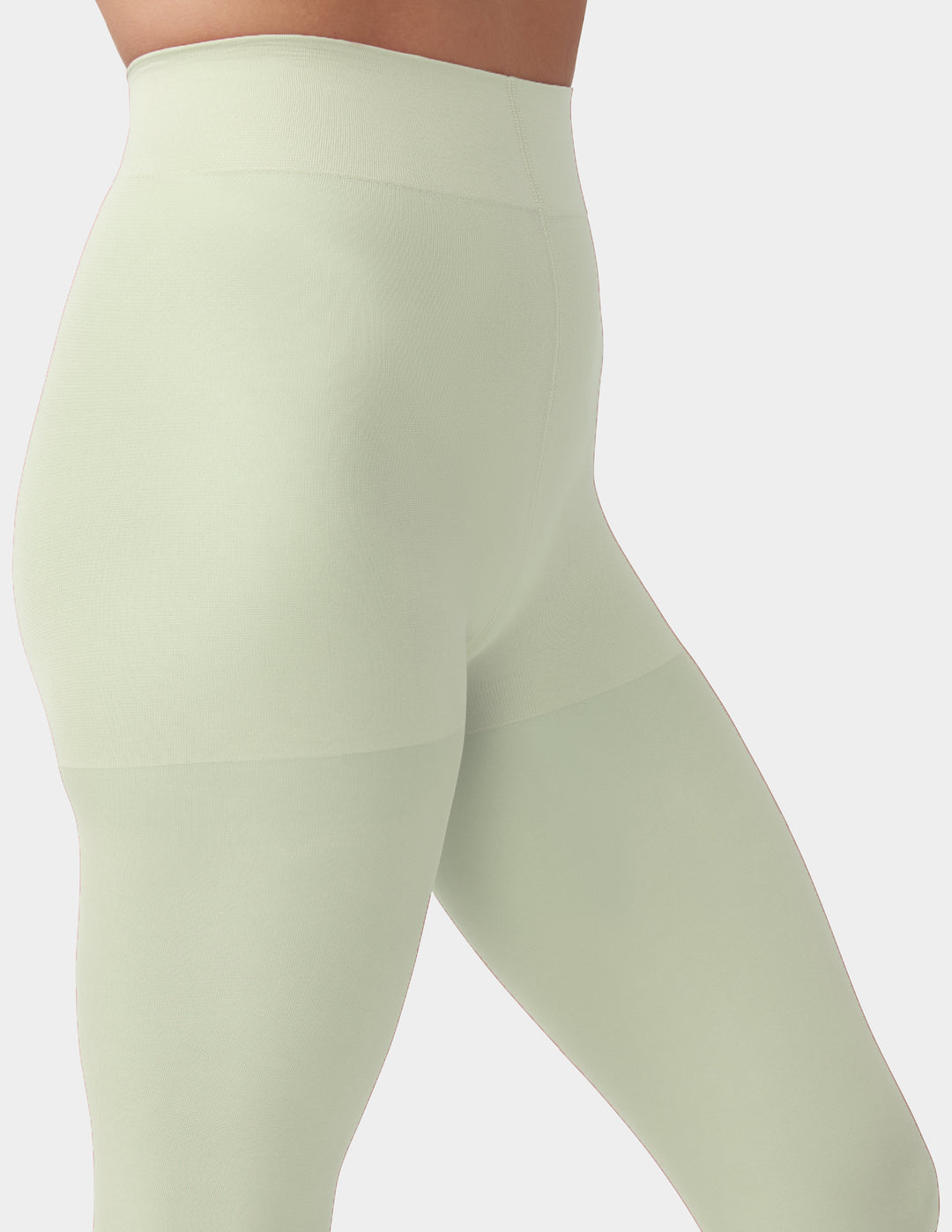 Close up of mint green tights with control top