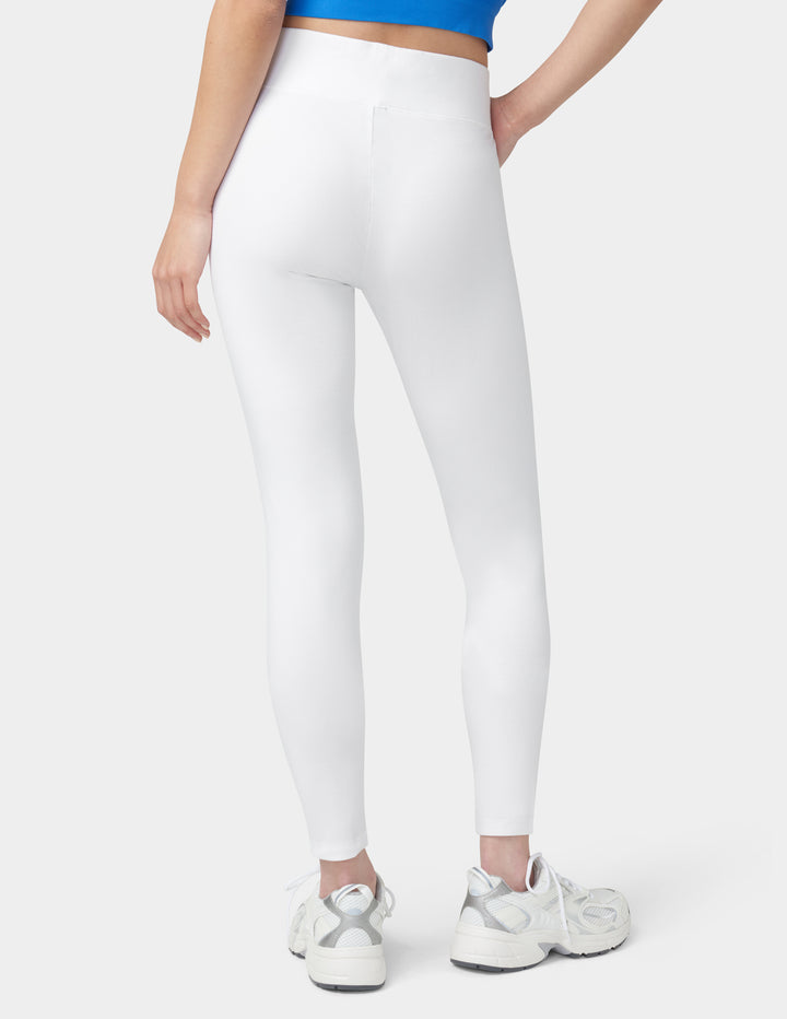 Person wearing white leggings on a white background