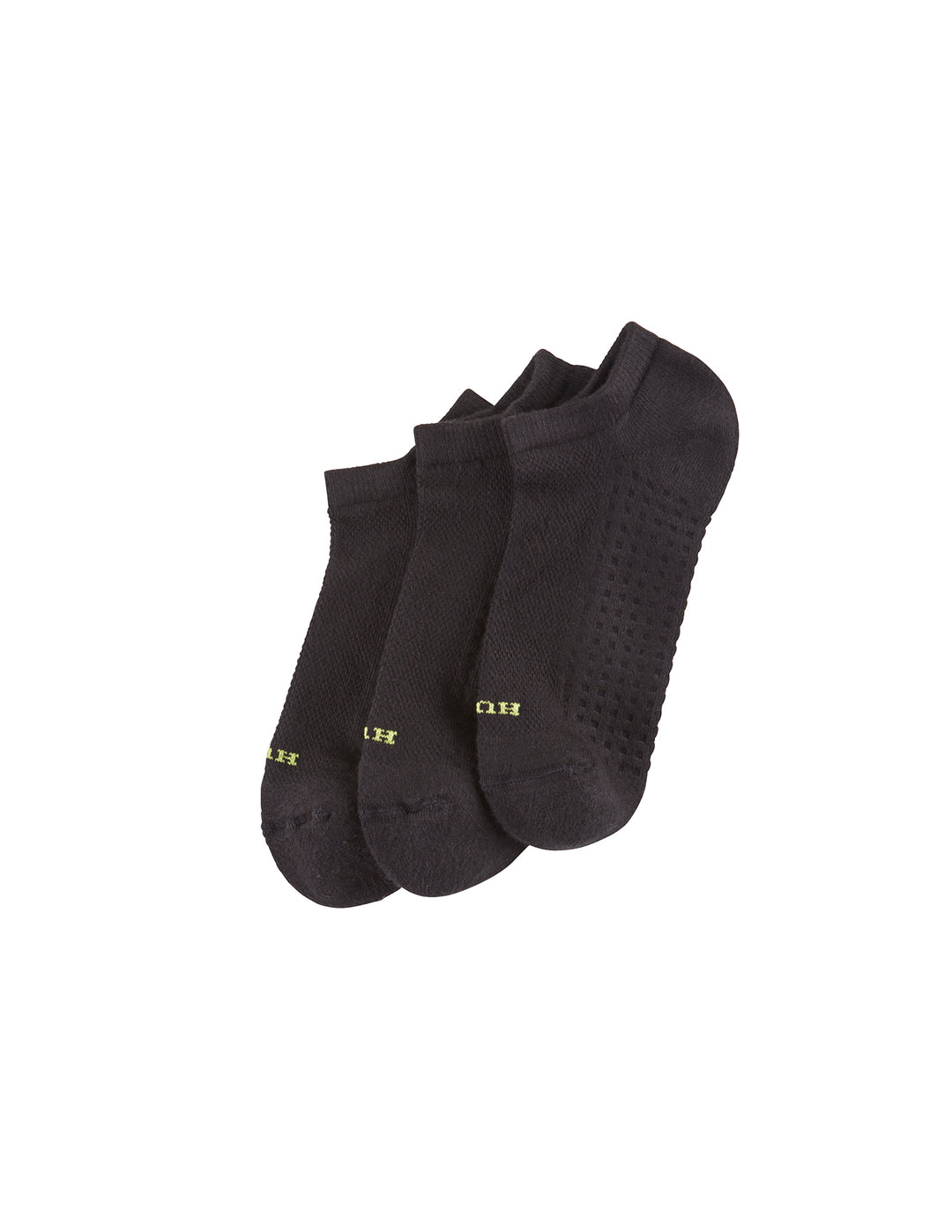 Three pairs of black no show socks on a solid white background