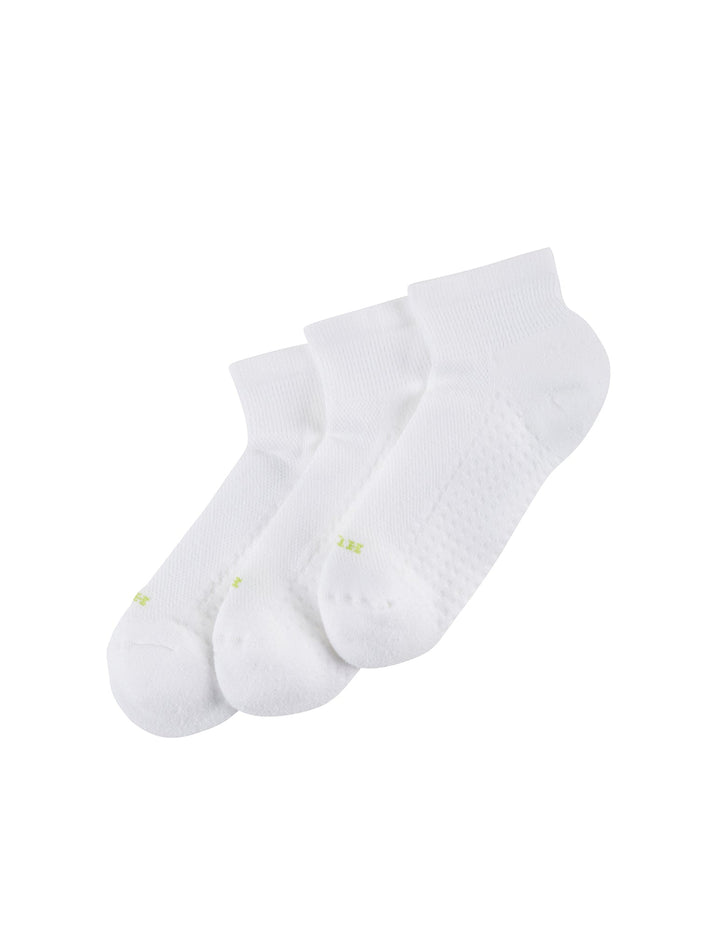 Three white ankle socks laying flat arranged on a white background
