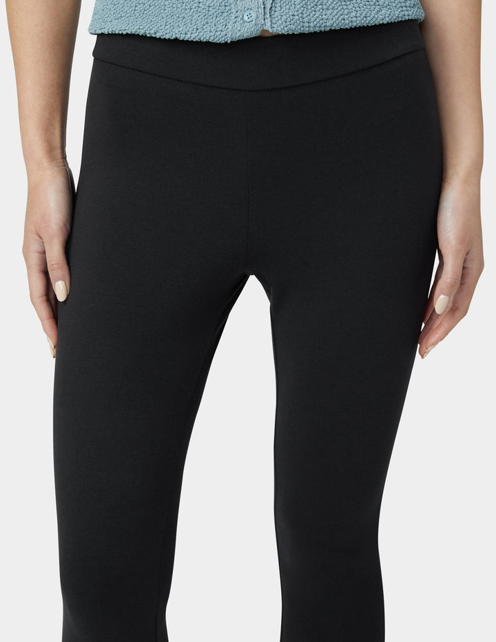Black leggings worn by a person on a white background