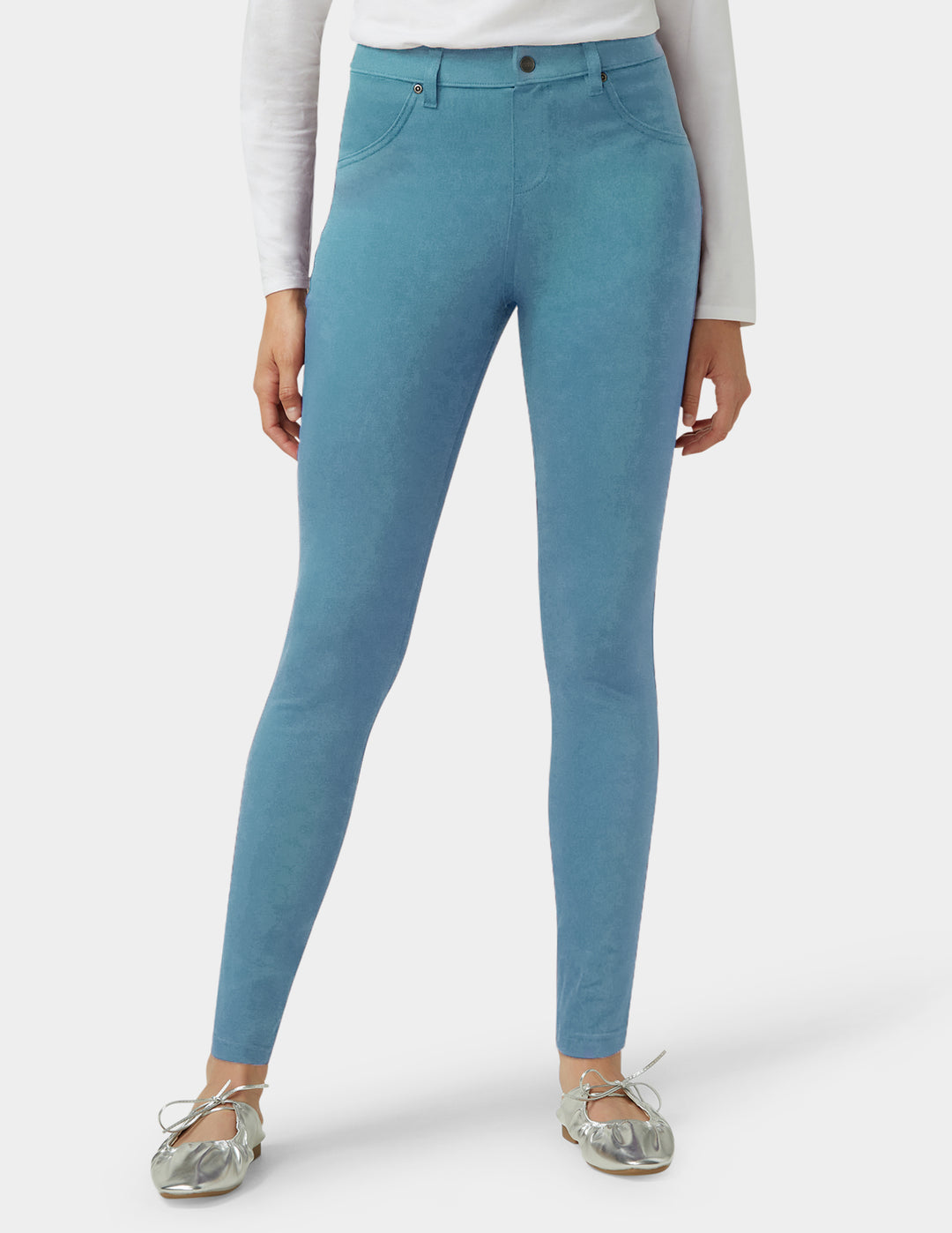 Teal pants worn by a person on a white background
