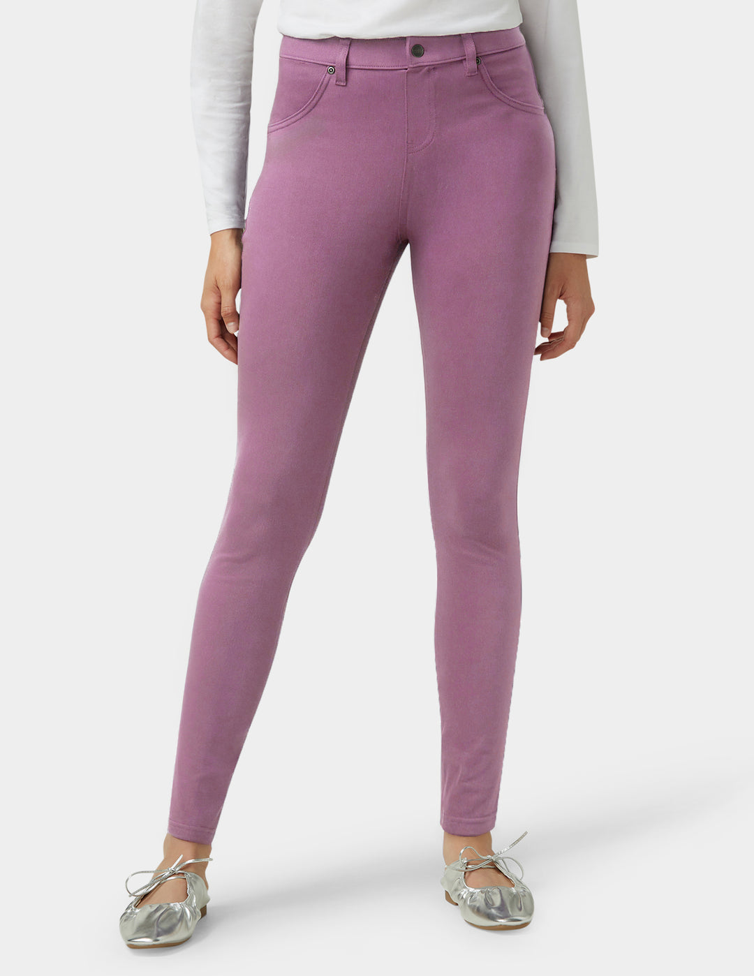 Purple pants worn by a person on a white background
