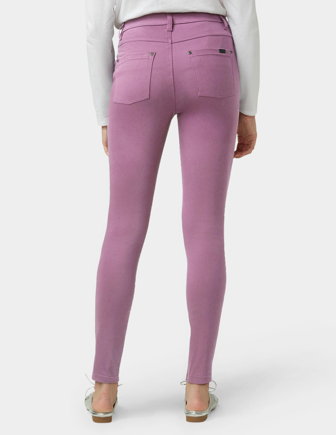 Purple pants worn by a person on a white background