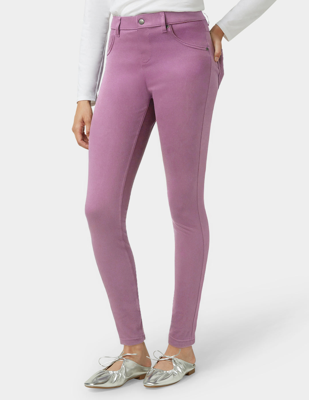 Purple pants worn by a person on a white background