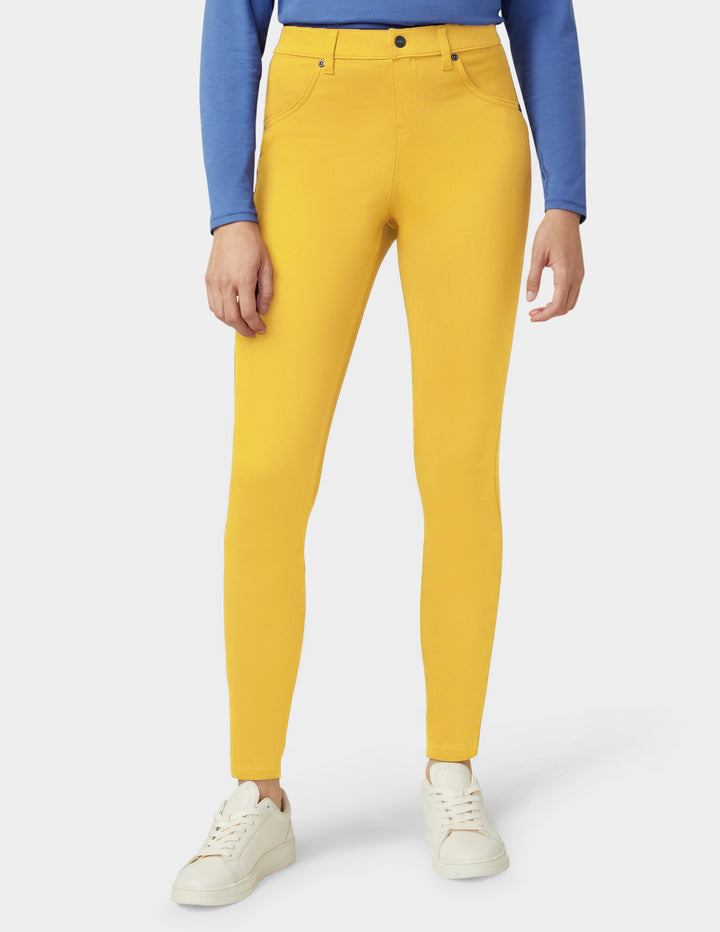Yellow pants worn by a person on a white background