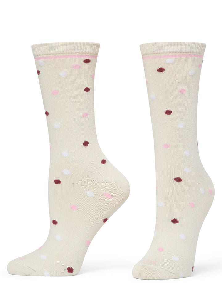 Pair of cream socks with colorful polka dots on a white background