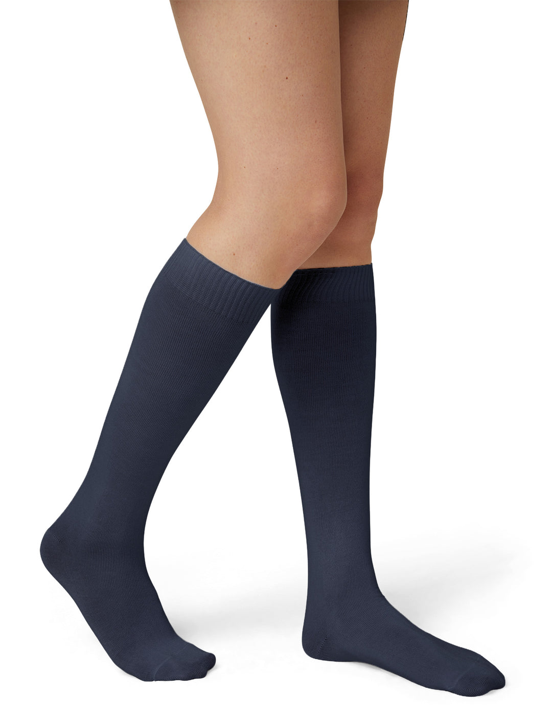 A model wearing navy knee high socks photographed against a light grey background.