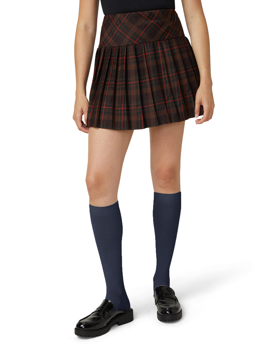 A model wearing navy knee high socks photographed against a light grey background.