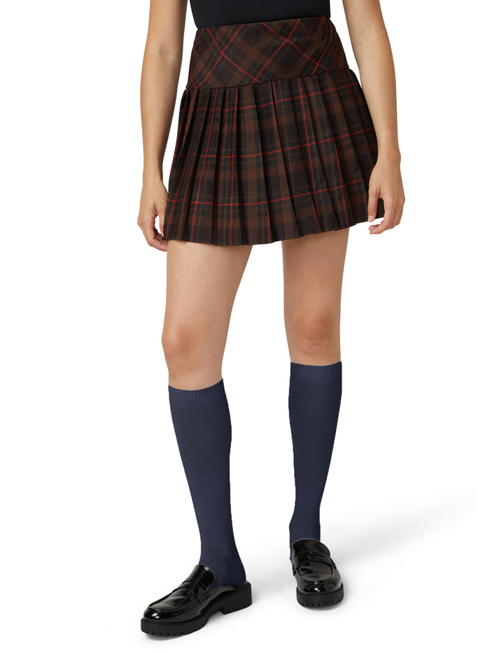 A model wearing navy knee high socks photographed against a light grey background.