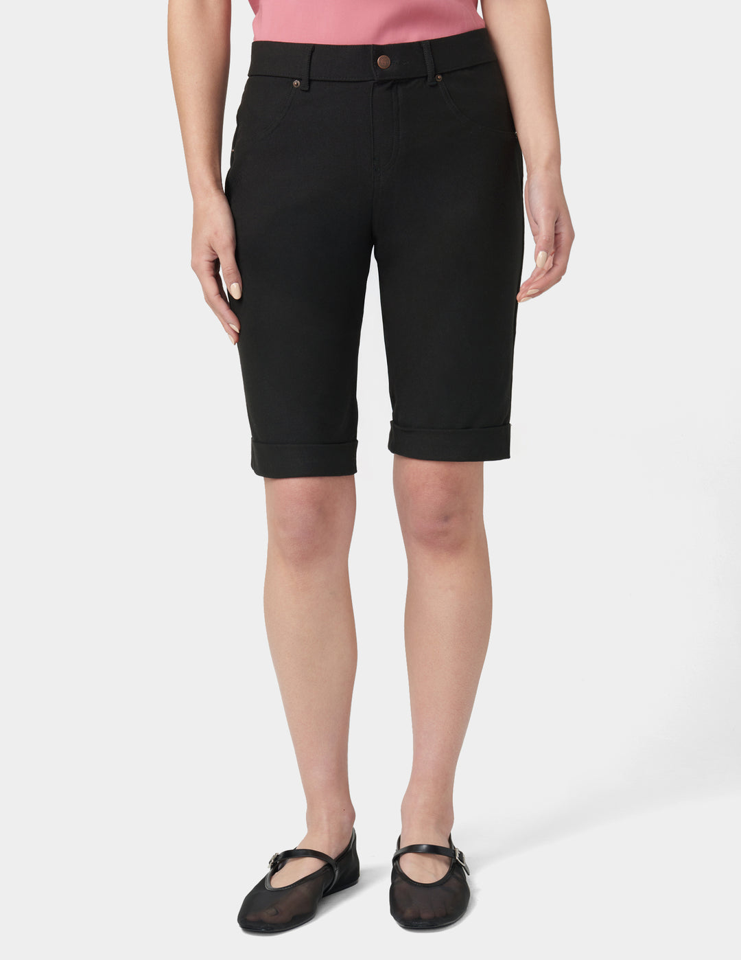 Person wearing black shorts on a white background