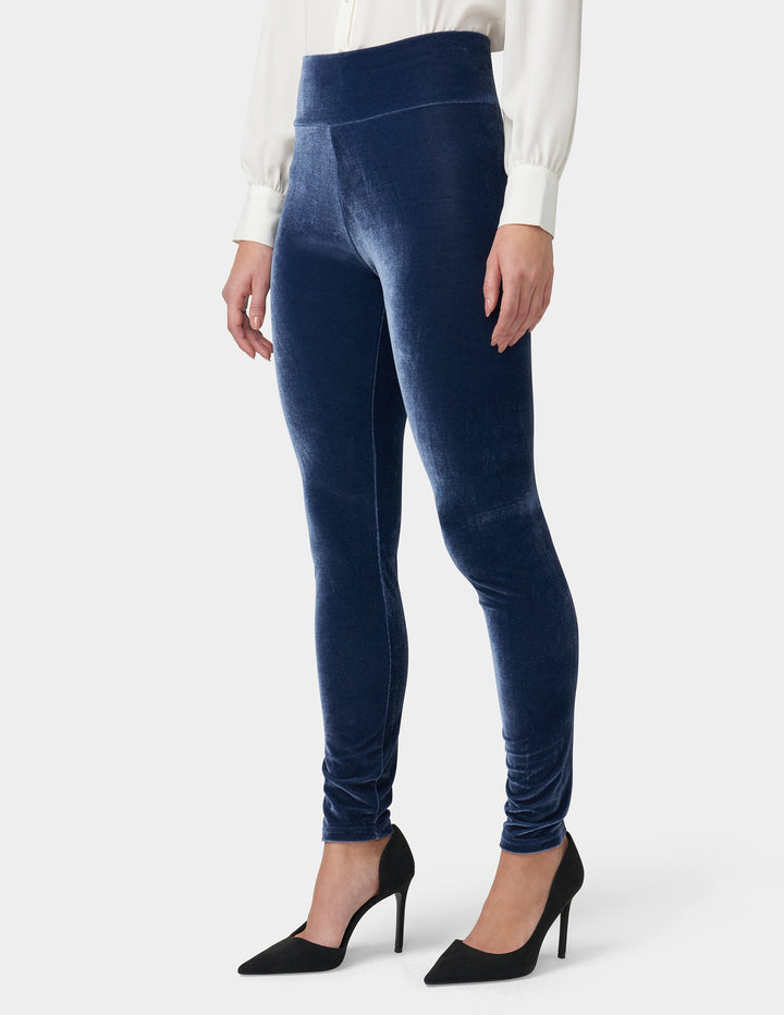 Woman wearing Peacoat velvet leggings