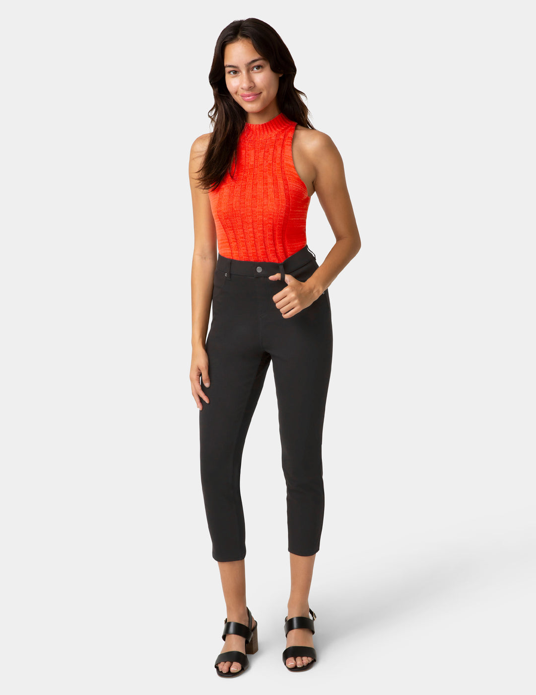 Woman wearing black capri pants and sleeveless top