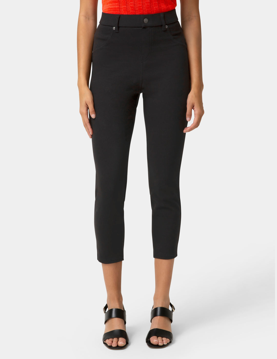 Person wearing black capri pants