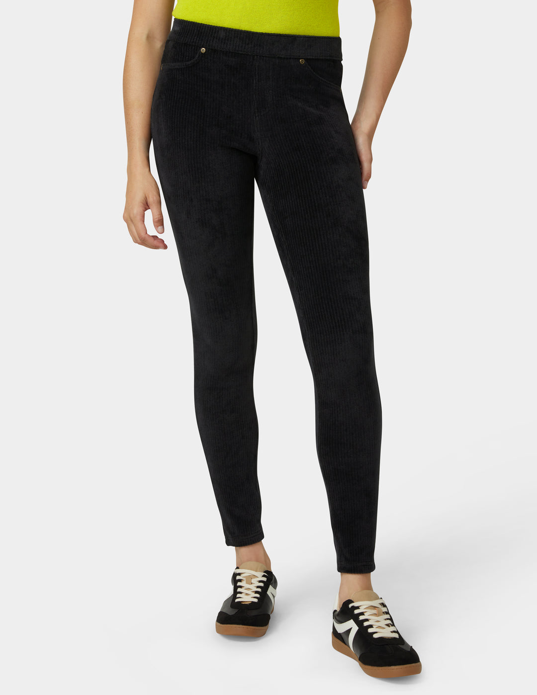 Person wearing black pants on a white background