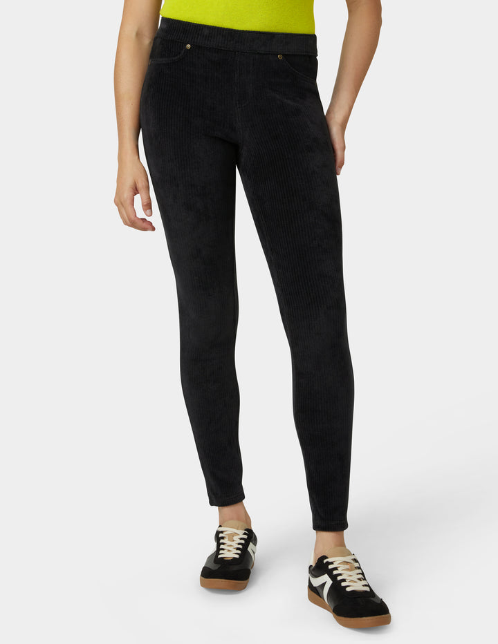 Person wearing black pants on a white background