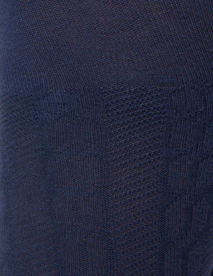 Close-up of a textured navy blue fabric