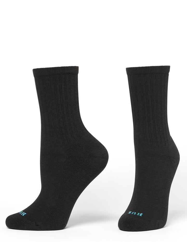 A pair of black socks with blue accent branding on a light gray background
