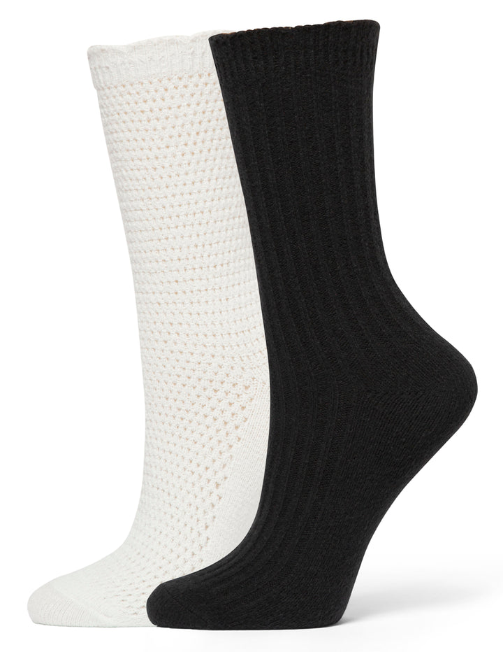Two socks, one white and one black, on a white background
