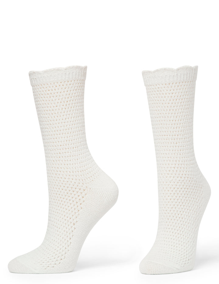 Pair of white textured socks on a white background