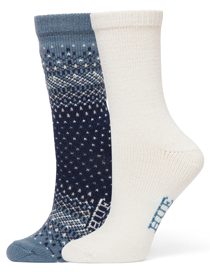 Two pairs of socks, one blue patterned and one white, on a white background