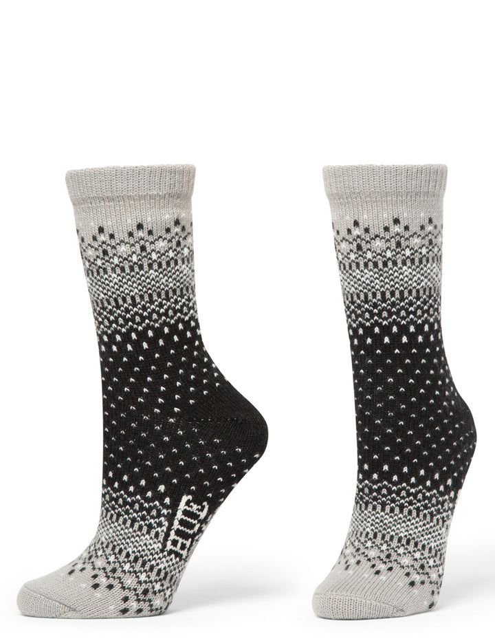 Pair of gray and black patterned socks on a white background
