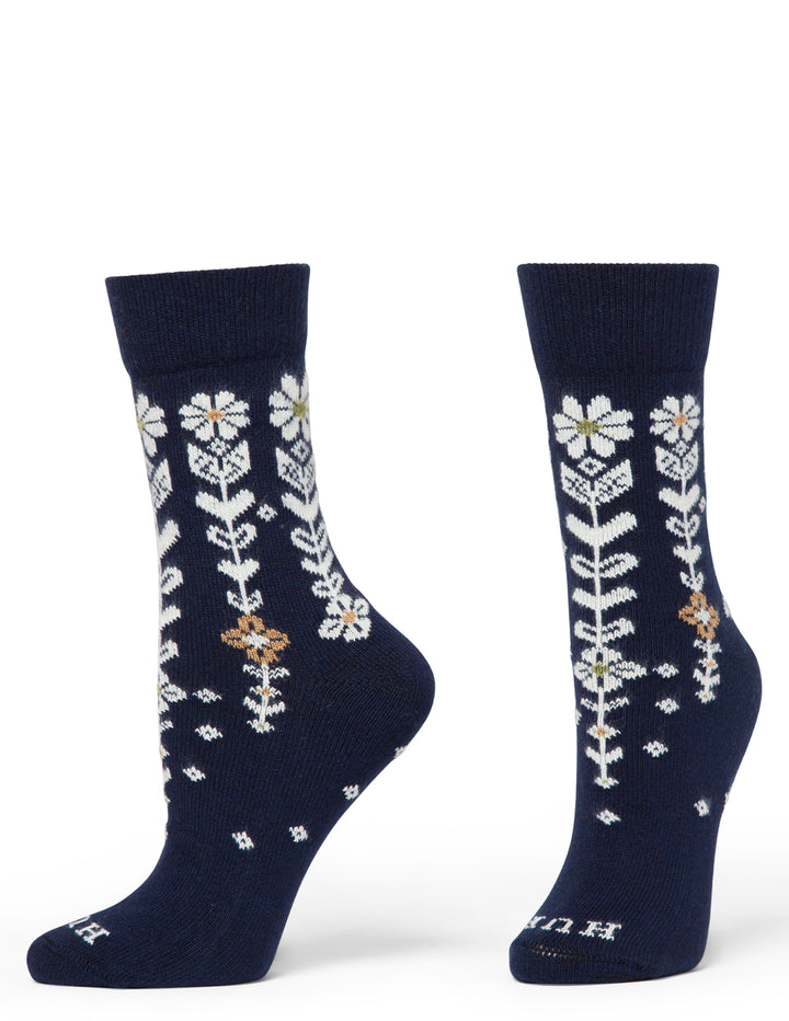 Navy blue socks with white floral patterns on a white background