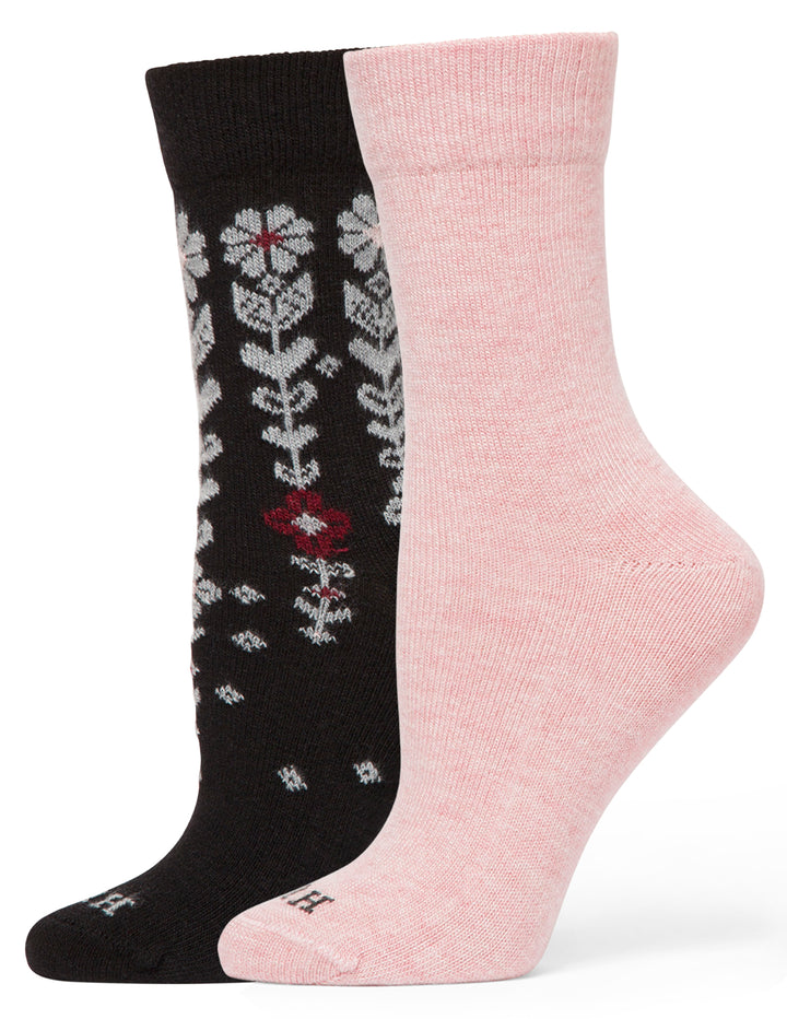 Two socks, one black with floral pattern and one pink, on a white background