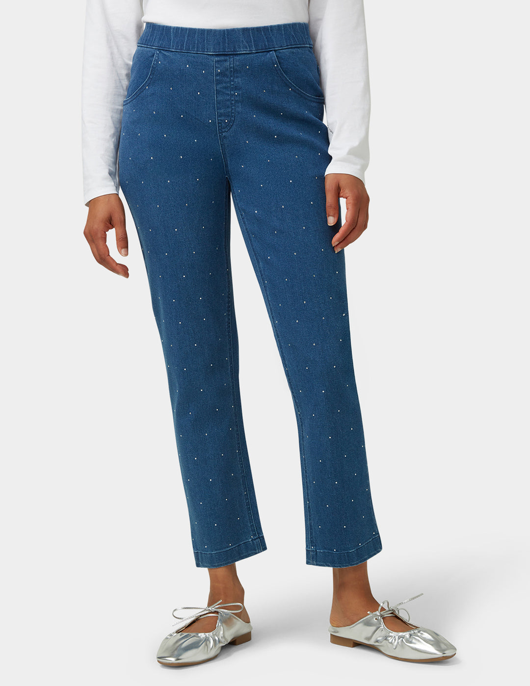 Blue pants worn by a person on a white background