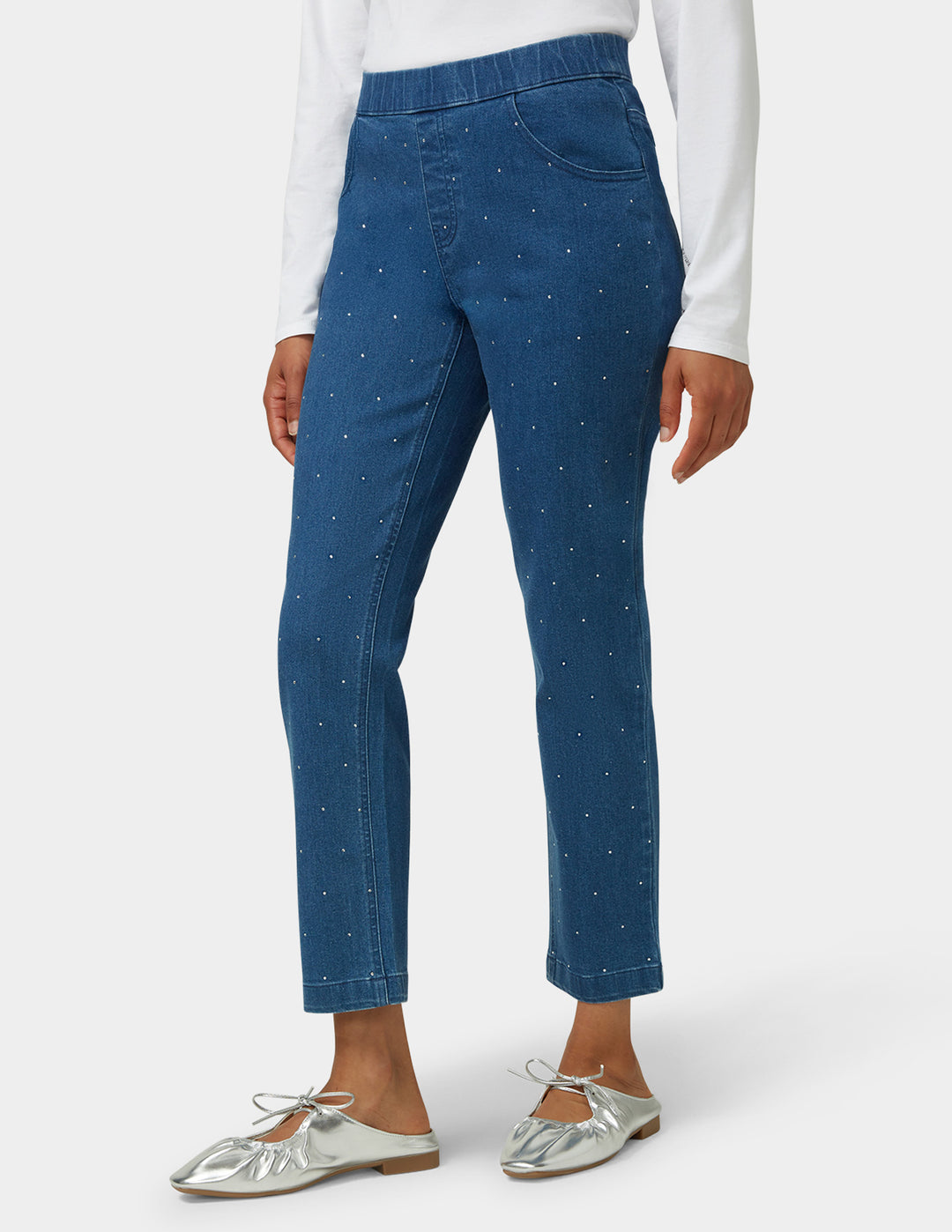 Blue pants worn by a person on a white background