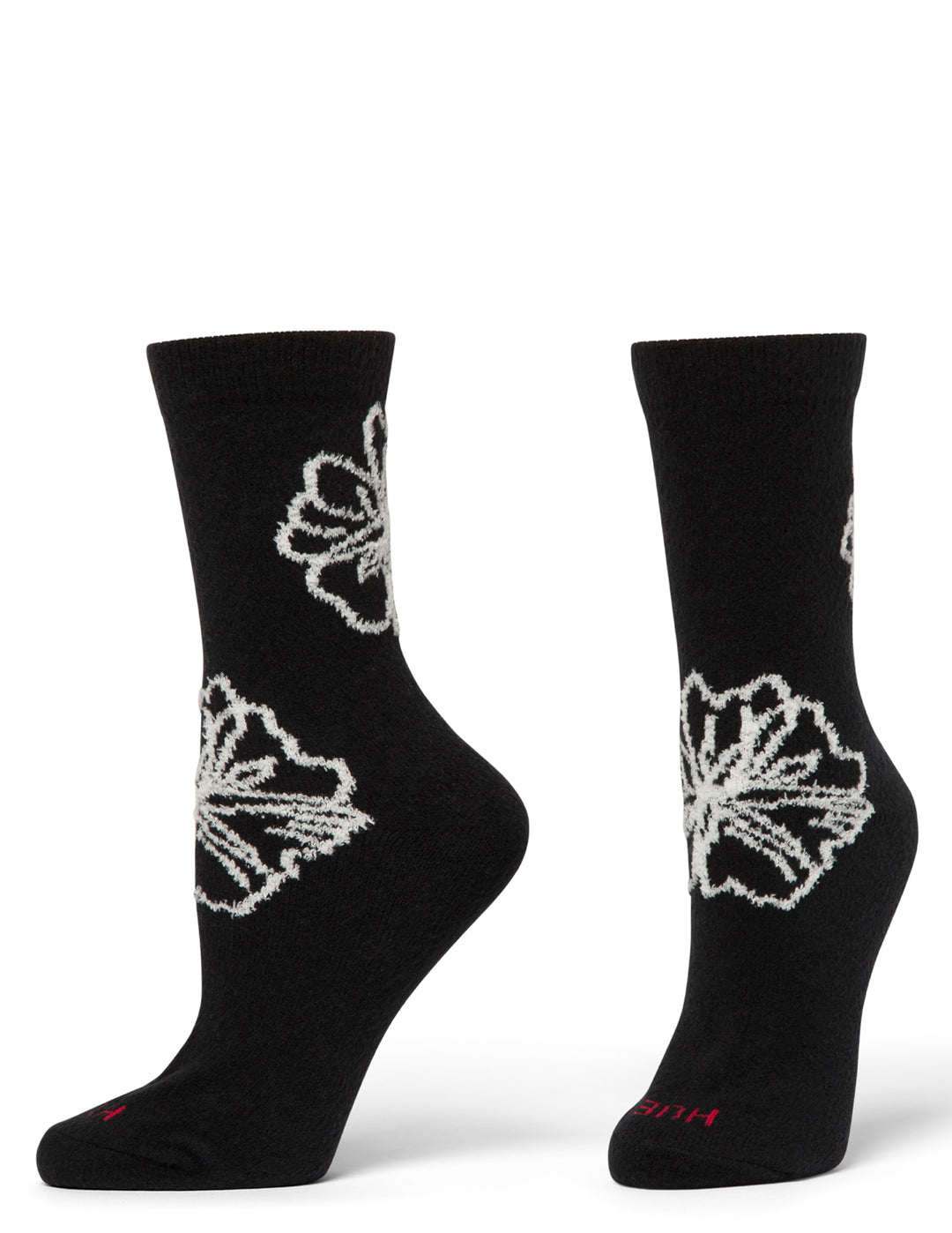 Black socks with white floral patterns on a white background