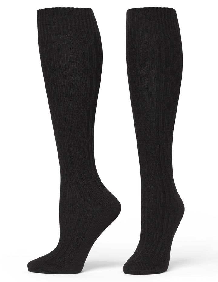Pair of black knee-high socks on a white background