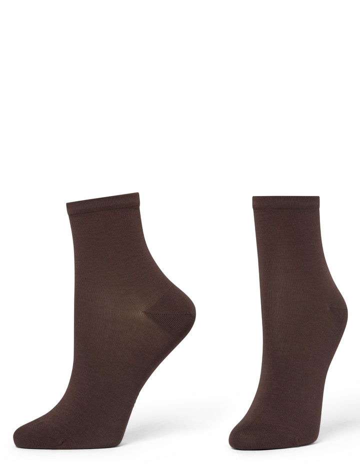 Pair of brown socks on a white background