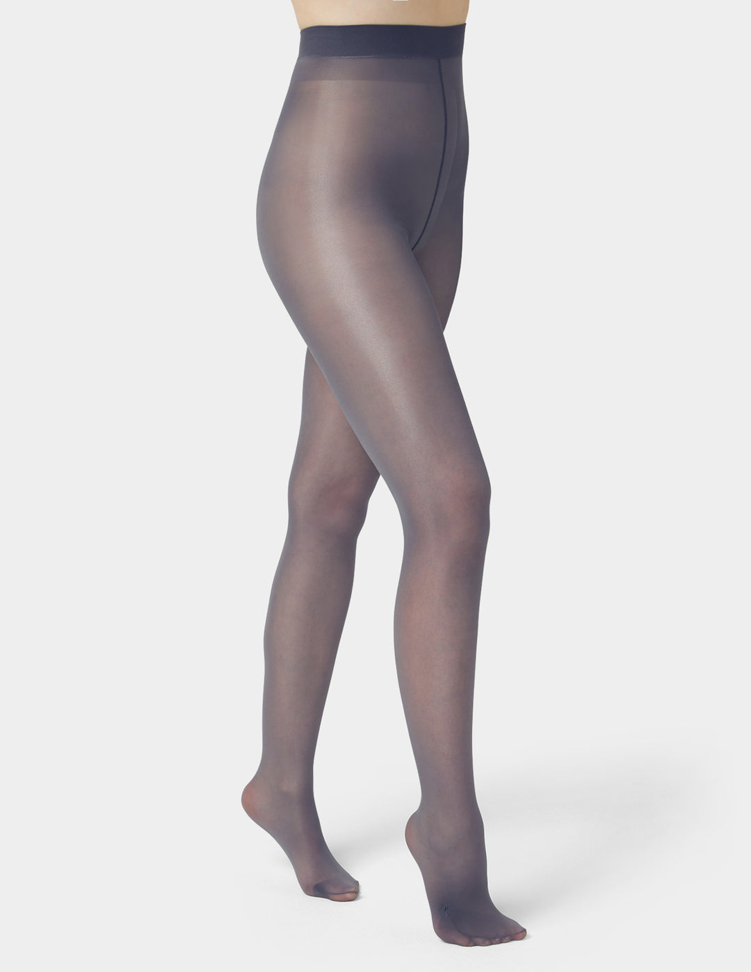 Sheer grey tights worn by a person on a white background