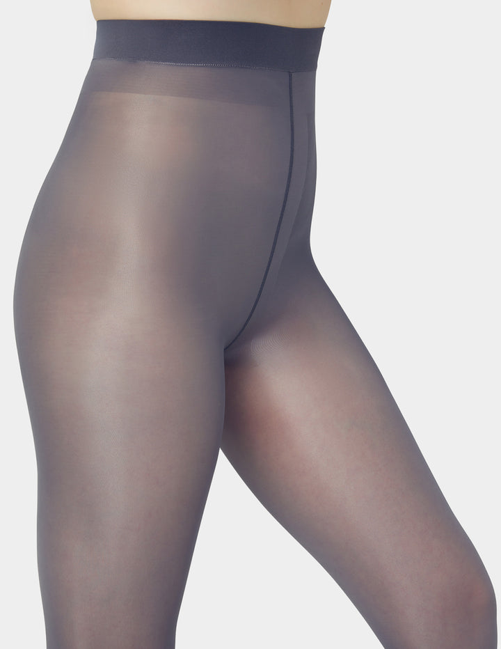 Grey sheer tights on a neutral background