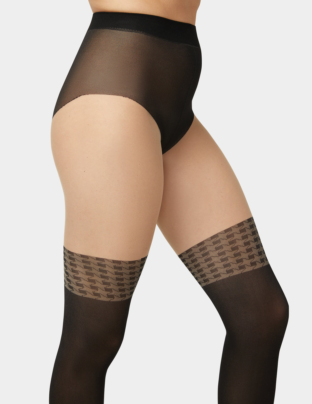 Black sheer stockings with patterned top section on a white background