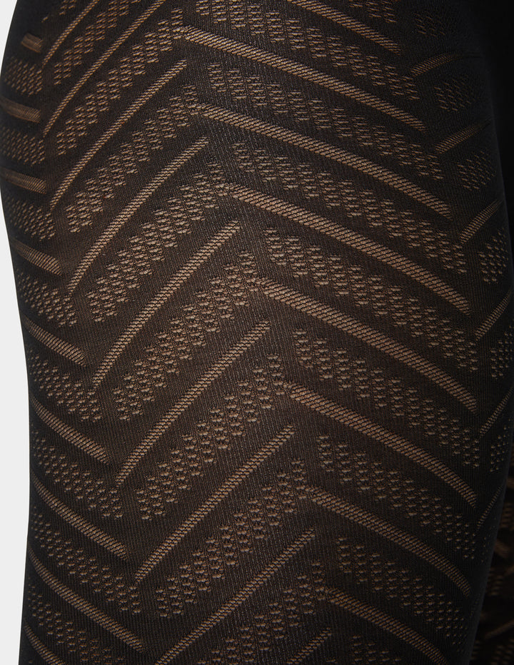 Close-up of a brown textured fabric with a geometric pattern