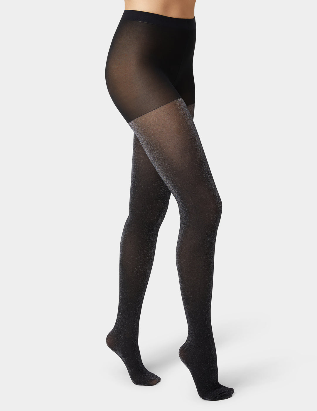 Black tights worn by a person on a white background