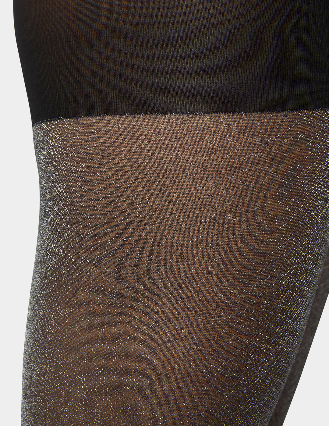 Close-up of sheer tights with a textured pattern on a white background