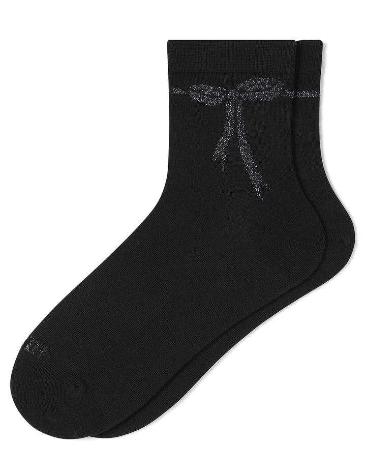 Black sock with a decorative bow design on a white background