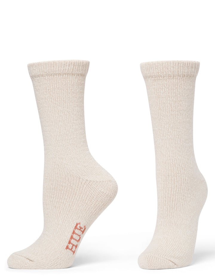 Pair of beige socks with 'Hue' branding on a white background