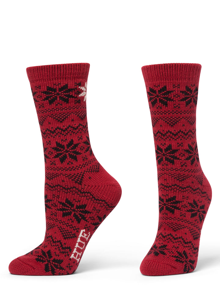 Red socks with black floral patterns on a white background